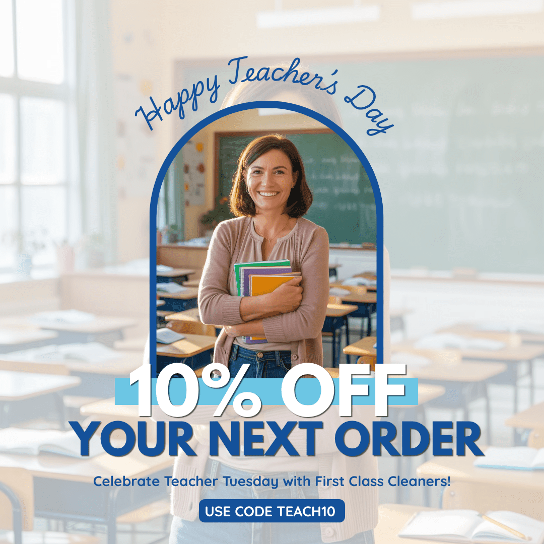 Smiling teacher holding books in a classroom with text offering 10% off your next order for Teacher's Day using code TEACH10.